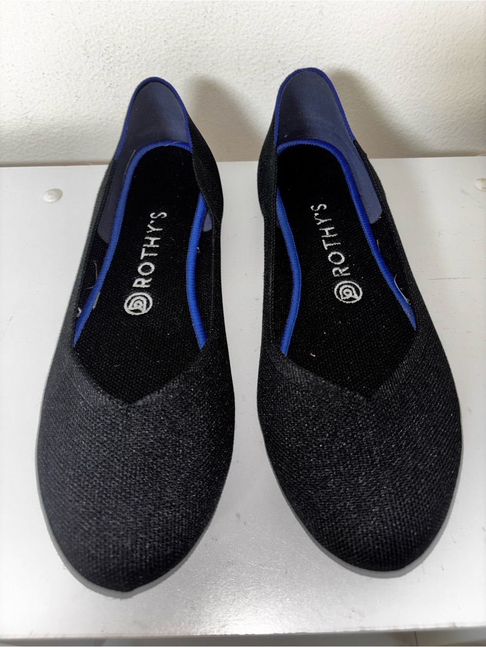 Rothy's Black Slip-On Loafers with Blue Trim